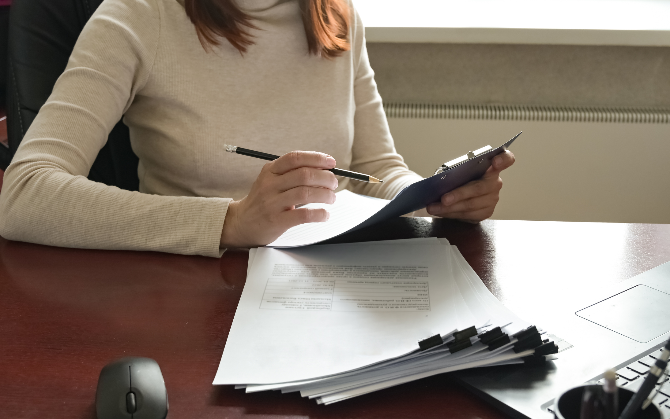 A close-up of employers or recruiters considering candidates' resumes, interviews, the concept of employment and recruitment, tips on making a good resume template, applying for a job