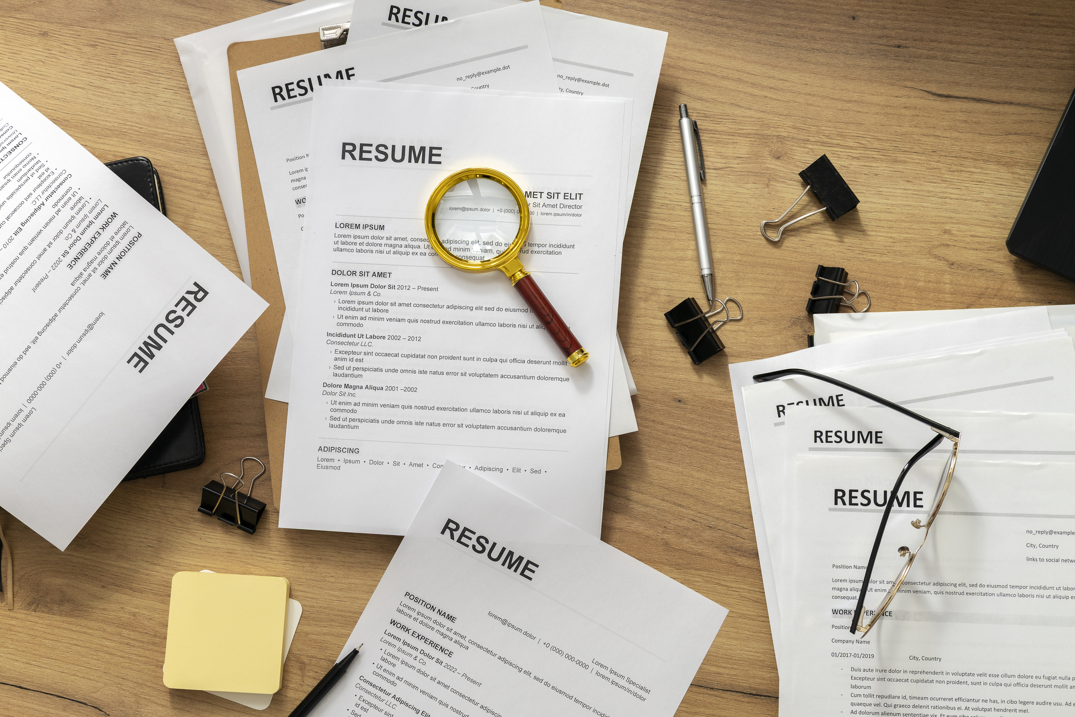 Preparing for job interview, recruiter examining CV documents and organizing candidate information on desk with office supplies, professional recruitment workflow. CV forms, hiring  proceess, Human Resources department